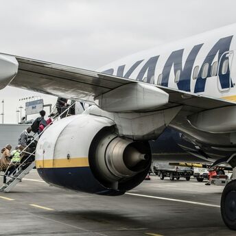 Passengers boarding a Ryanair aircraft on the tarmac