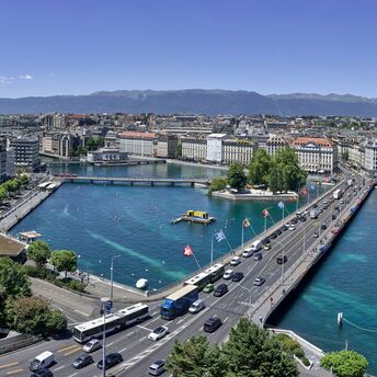 Panoramic view of Geneva and Lake Geneva with mountains in the background