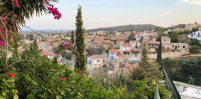 Traditional Cypriot village with stone houses and red-tiled roofs