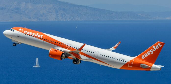 easyJet aircraft flying over the sea