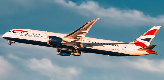 British Airways Boeing 787 Dreamliner flying against a cloudy sky
