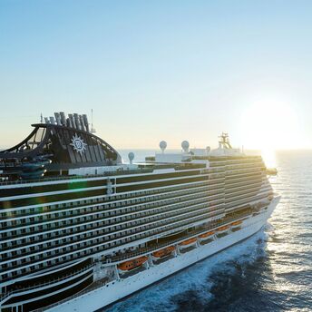 MSC cruise ship sailing at sunset