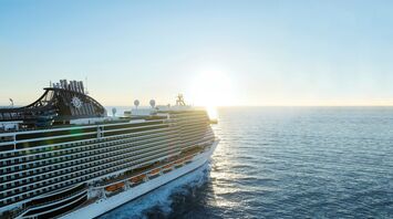 MSC cruise ship sailing at sunset