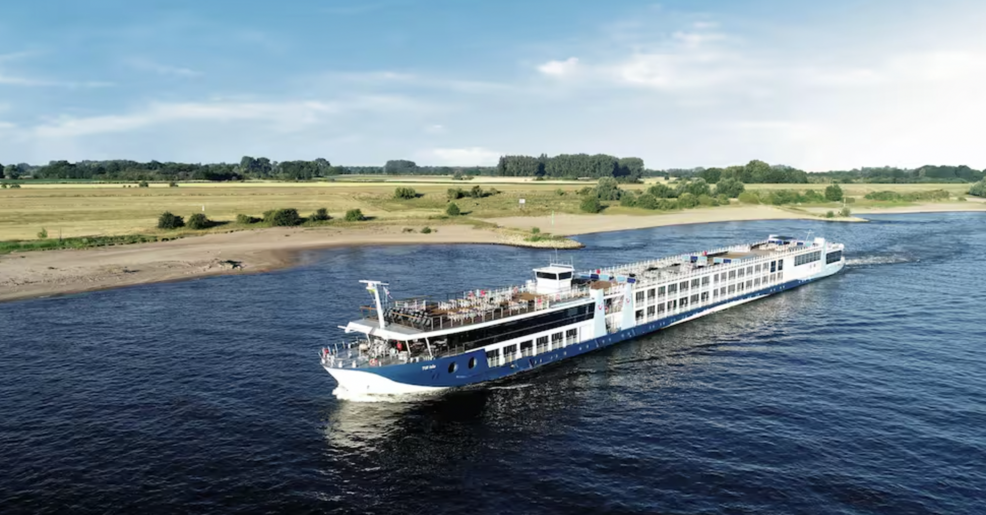 TUI river cruise ship sailing along a river