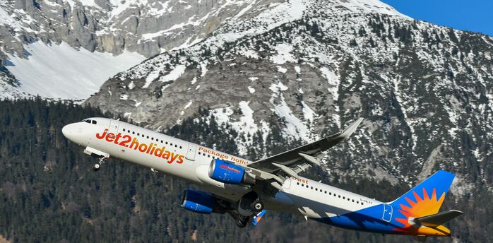 Jet2 aircraft taking off above the sea