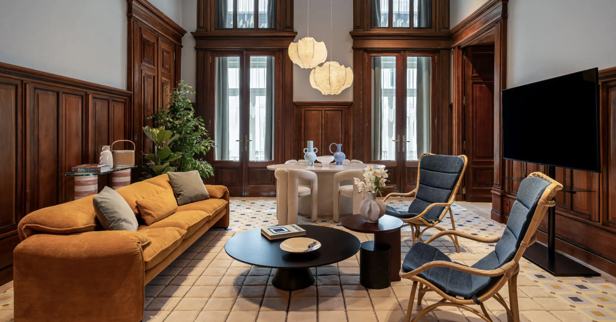Elegant Andaz Lisbon interior with an orange sofa, wooden panelling and modern furniture