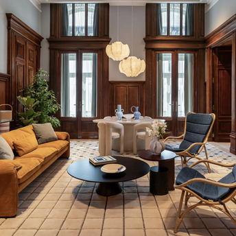 Elegant Andaz Lisbon interior with an orange sofa, wooden panelling and modern furniture