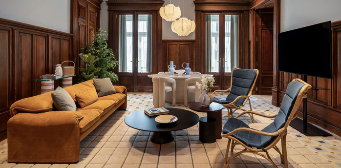 Elegant Andaz Lisbon interior with an orange sofa, wooden panelling and modern furniture