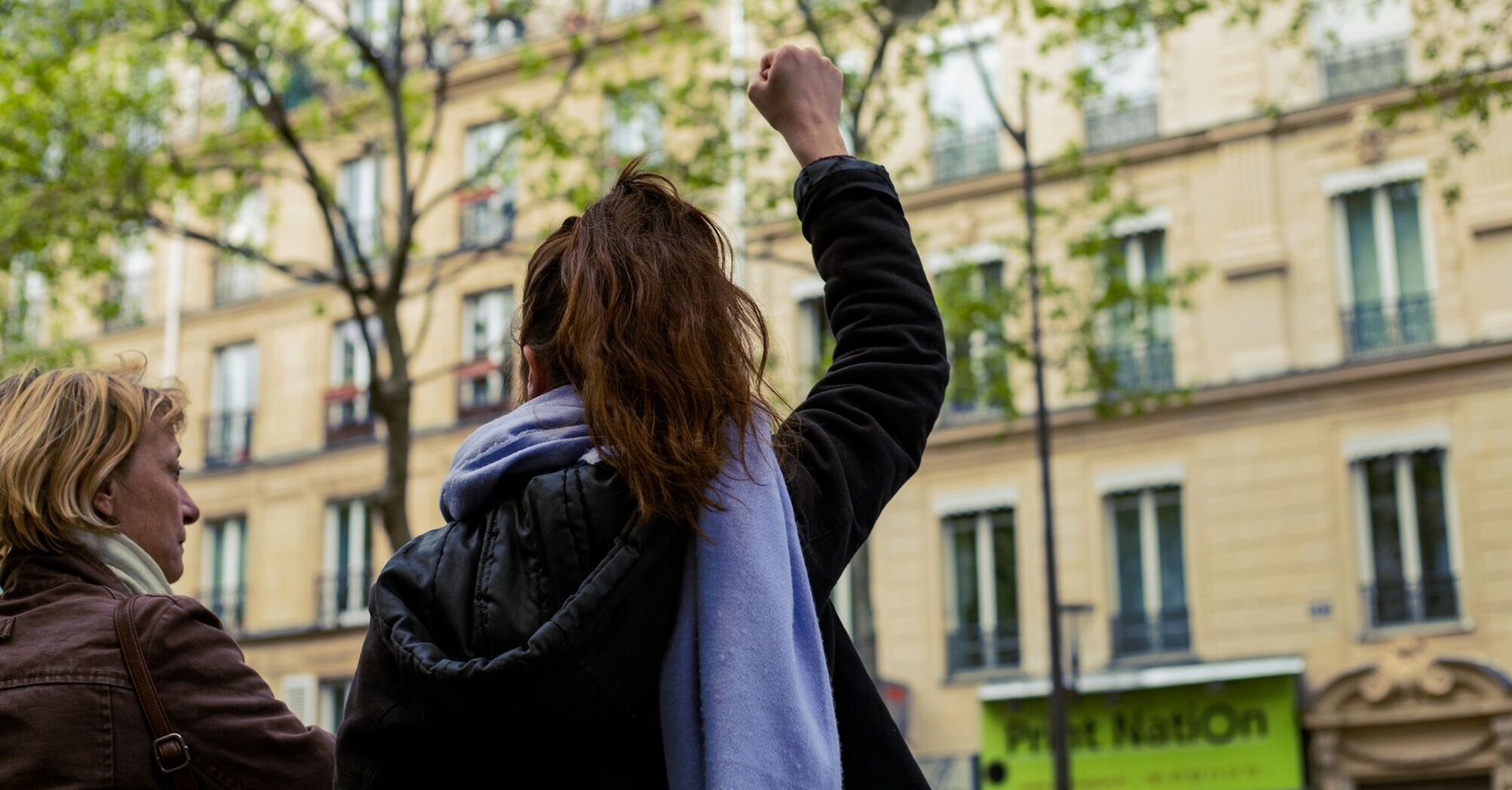 Woman raising her fist during a street protest