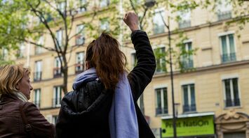 Woman raising her fist during a street protest