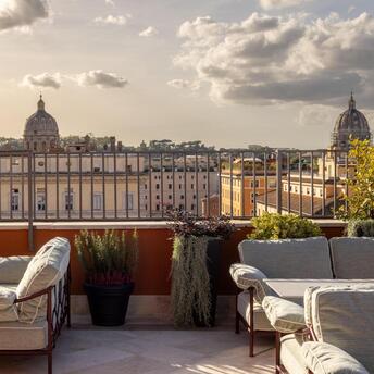 Terrace seating overlooking Rome’s rooftops at Thompson Rome
