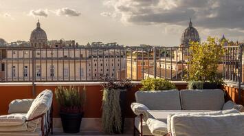 Terrace seating overlooking Rome’s rooftops at Thompson Rome