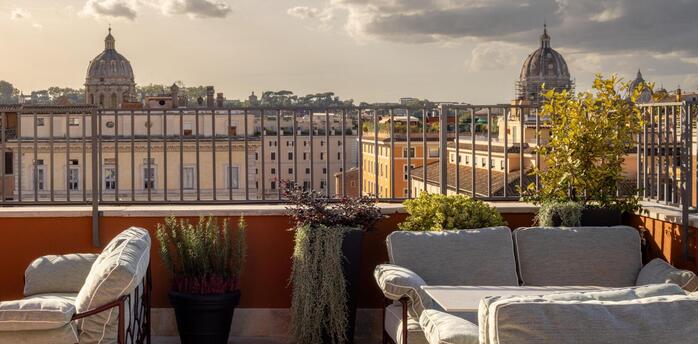 Terrace seating overlooking Rome’s rooftops at Thompson Rome