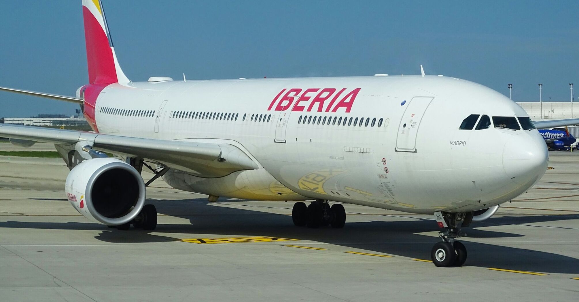 Iberia passenger aircraft taxiing at an airport