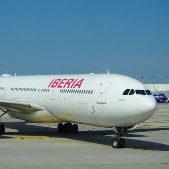 Iberia passenger aircraft taxiing at an airport