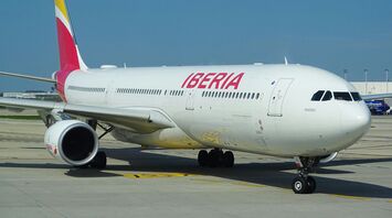 Iberia passenger aircraft taxiing at an airport