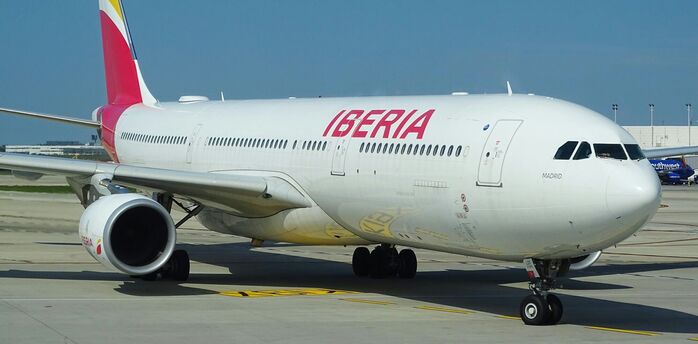 Iberia passenger aircraft taxiing at an airport