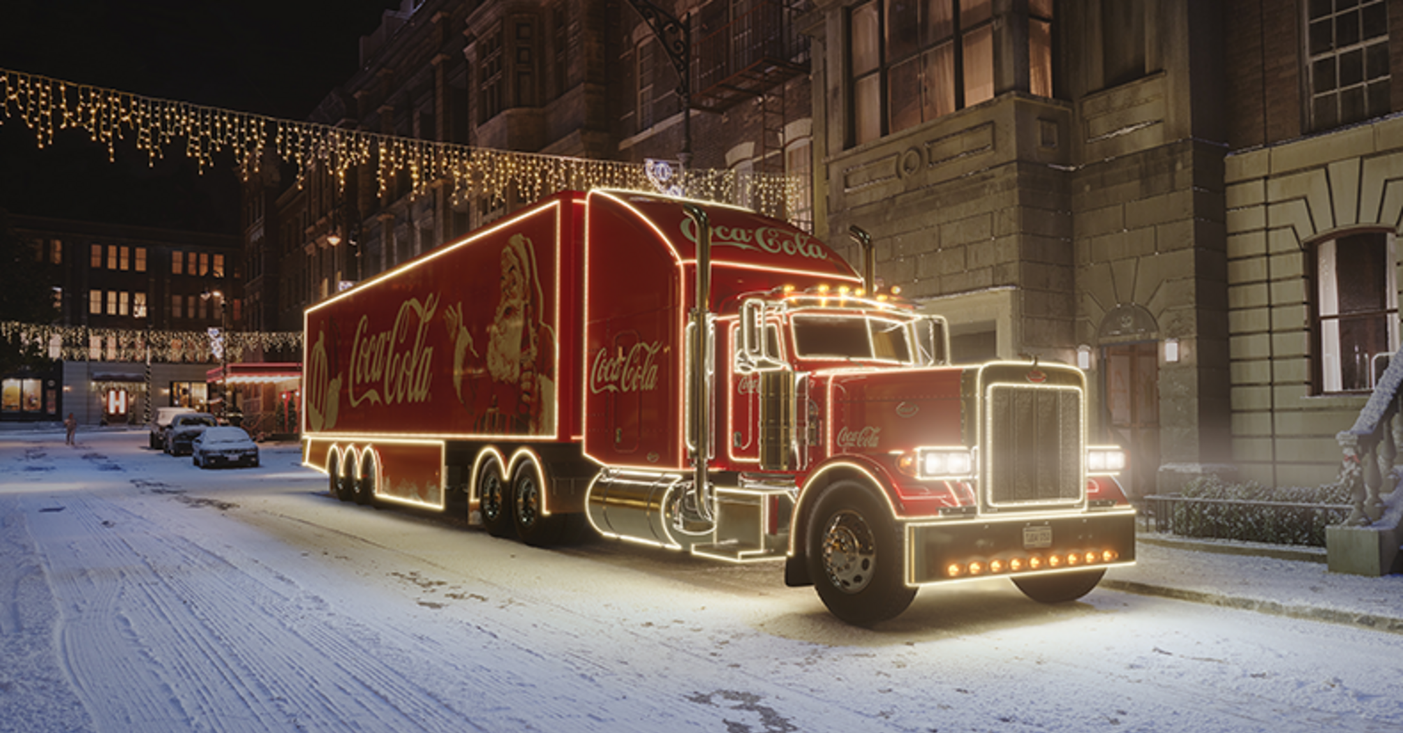 Illuminated Coca-Cola Christmas truck on a snowy street