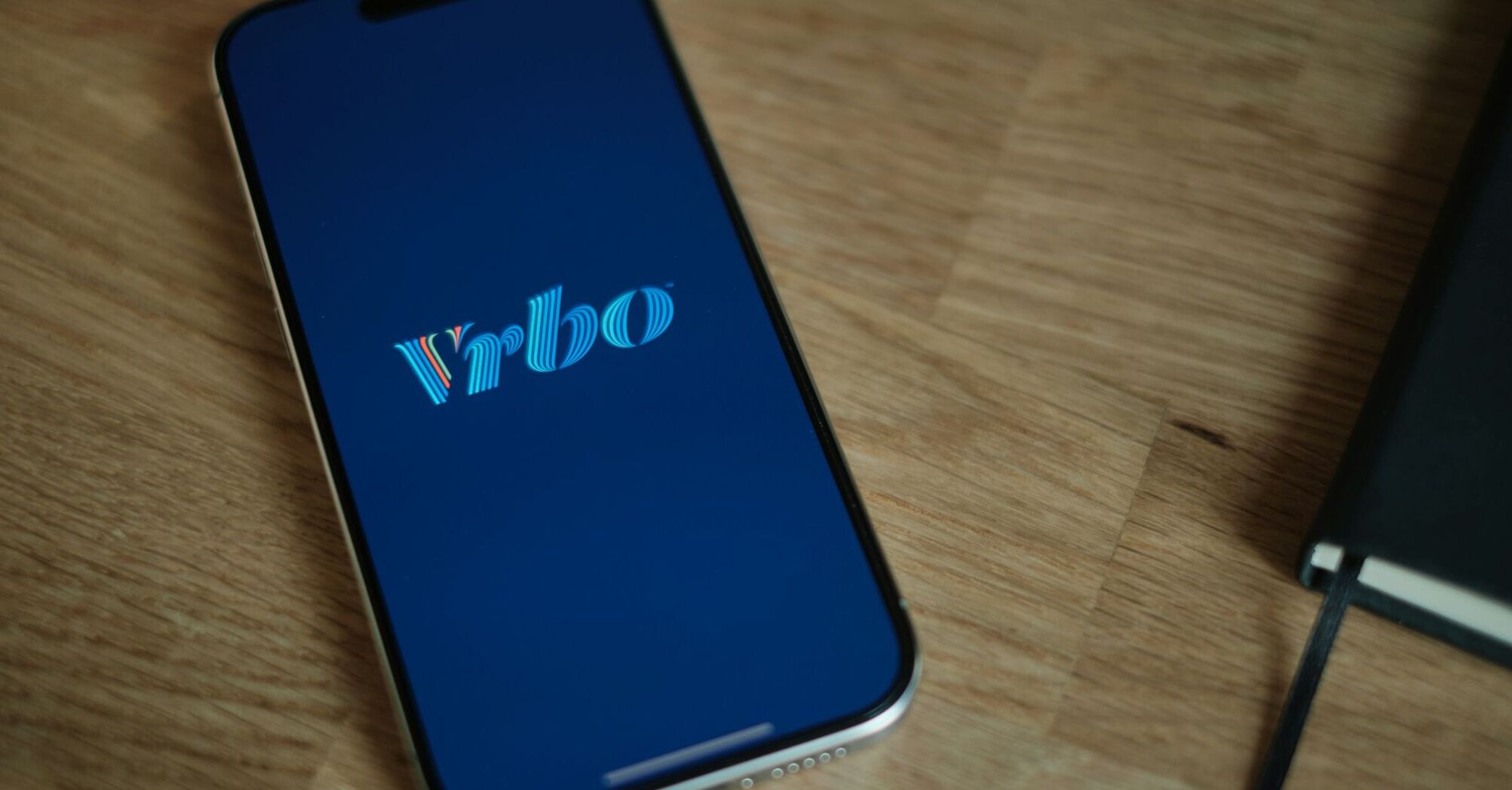 Vrbo logo on a smartphone screen