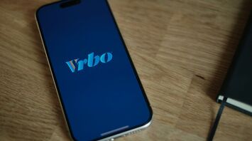 Vrbo logo on a smartphone screen