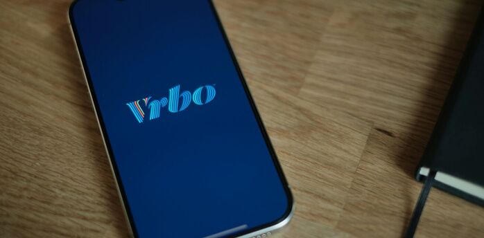 Vrbo logo on a smartphone screen