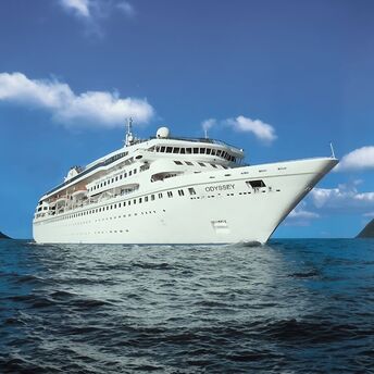 Villa Vie Odyssey cruise ship sailing between snow-covered mountains