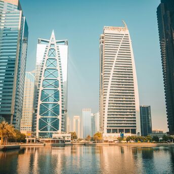 Modern skyscrapers overlooking a waterfront in Dubai