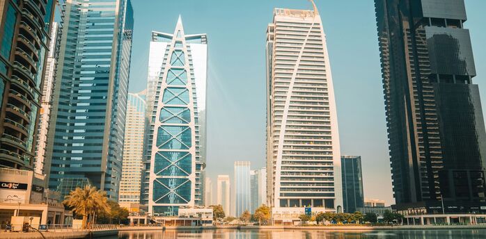 Modern skyscrapers overlooking a waterfront in Dubai