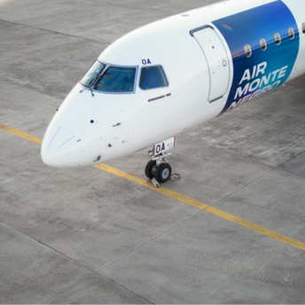 Air Montenegro Embraer 195 aircraft parked on an airport apron