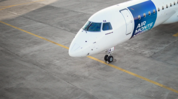 Air Montenegro Embraer 195 aircraft parked on an airport apron