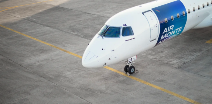 Air Montenegro Embraer 195 aircraft parked on an airport apron