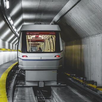 Skymetro train travelling through a tunnel at Zurich Airport
