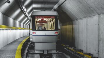 Skymetro train travelling through a tunnel at Zurich Airport