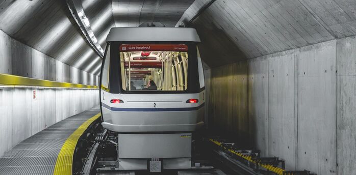 Skymetro train travelling through a tunnel at Zurich Airport