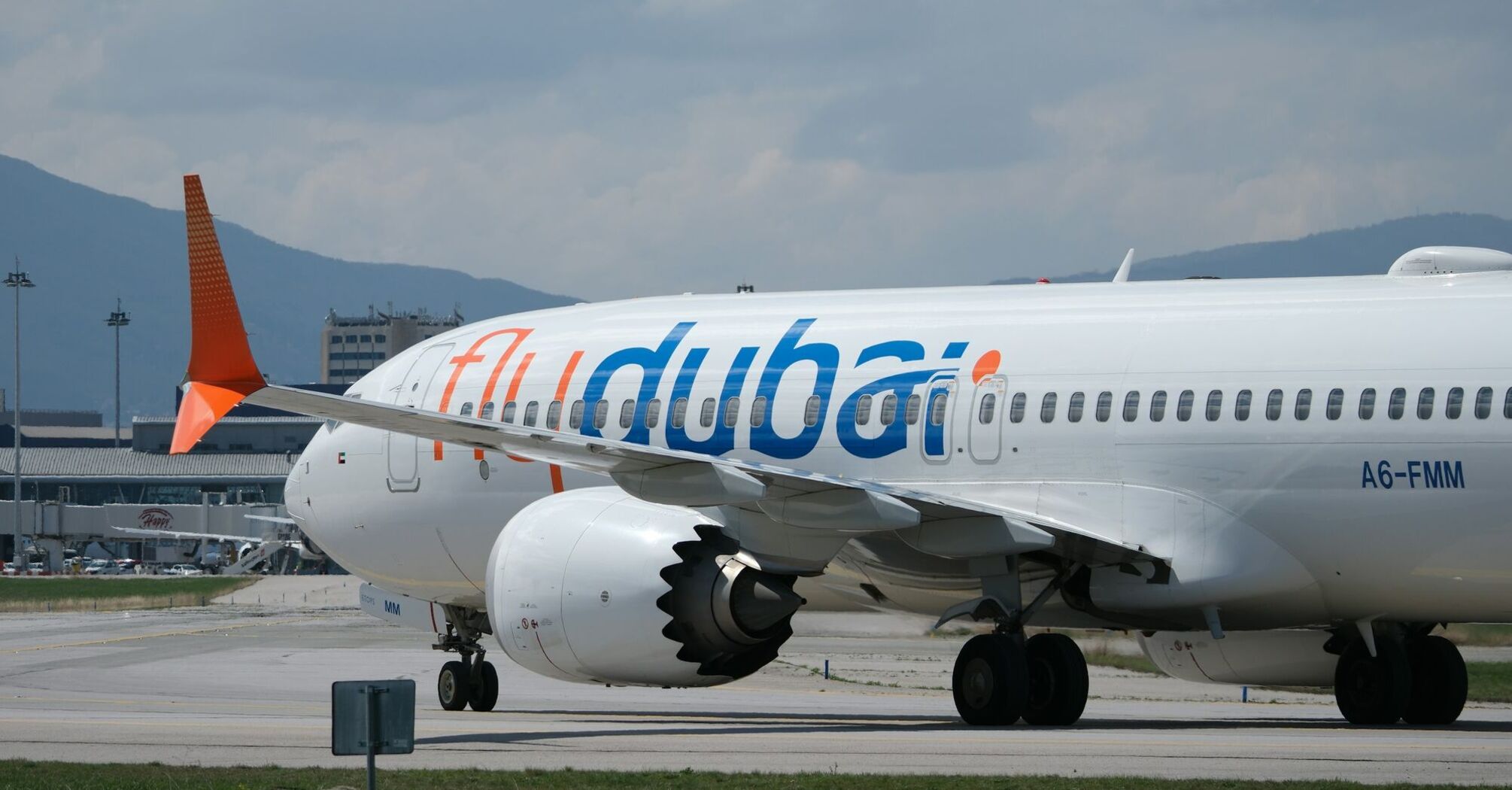 Flydubai aircraft taxiing at an airport