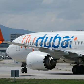 Flydubai aircraft taxiing at an airport