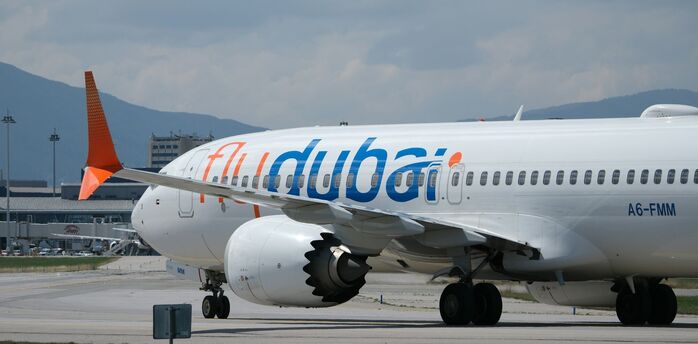 Flydubai aircraft taxiing at an airport