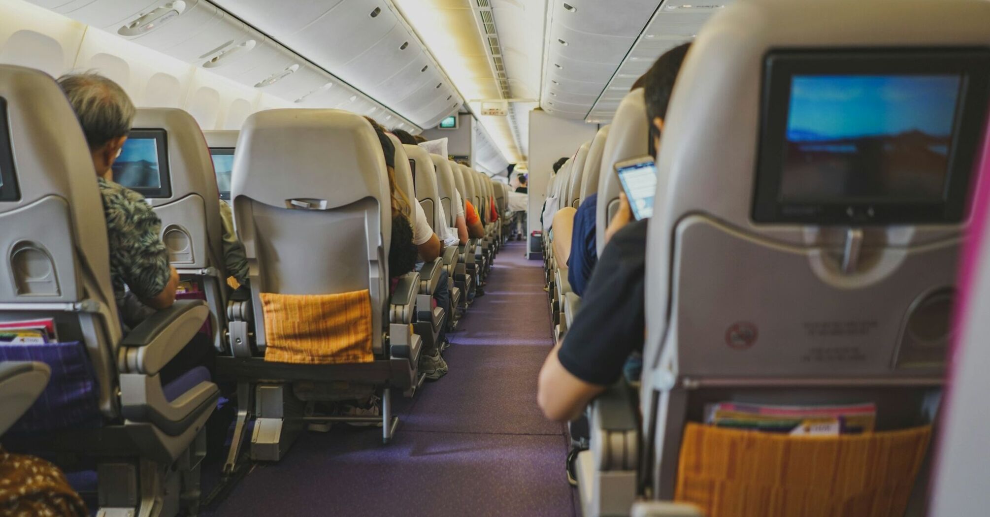 Passengers seated inside an aircraft cabin