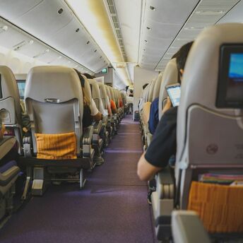 Passengers seated inside an aircraft cabin