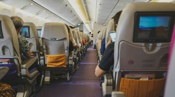 Passengers seated inside an aircraft cabin
