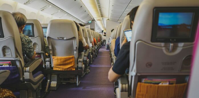 Passengers seated inside an aircraft cabin