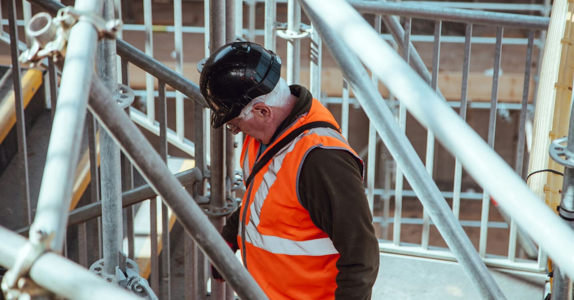 Rail worker among station scaffolding