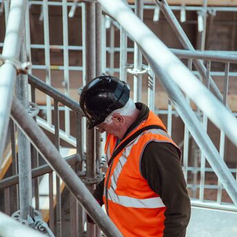 Rail worker among station scaffolding