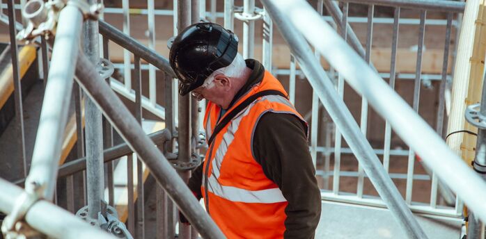Rail worker among station scaffolding