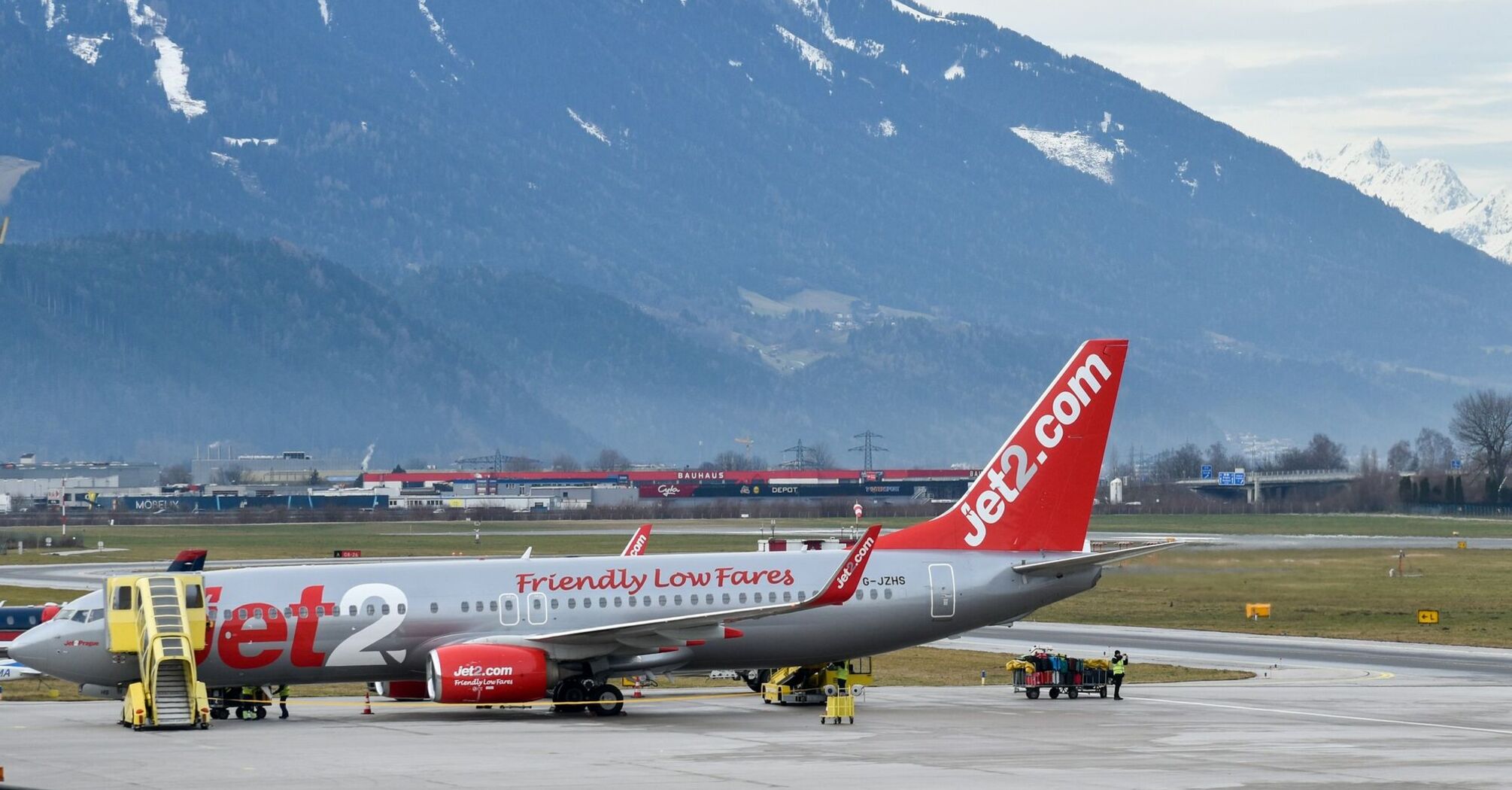 Jet2 plane with snowy mountains behind