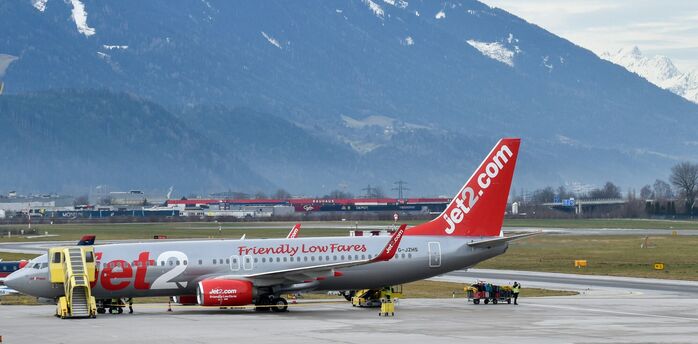 Jet2 plane with snowy mountains behind