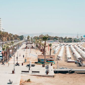 Palm-lined seafront and beach in Larnaca, Cyprus