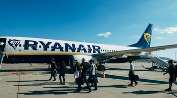 Passengers boarding a Ryanair aircraft on the apron