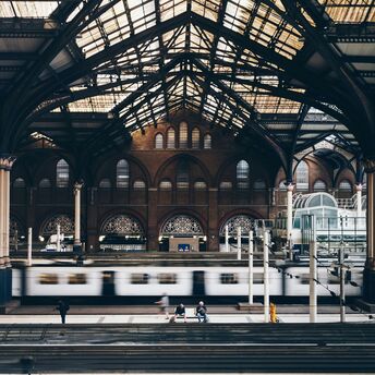 Interior of London Liverpool Street Station with platforms and trains