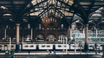 Interior of London Liverpool Street Station with platforms and trains